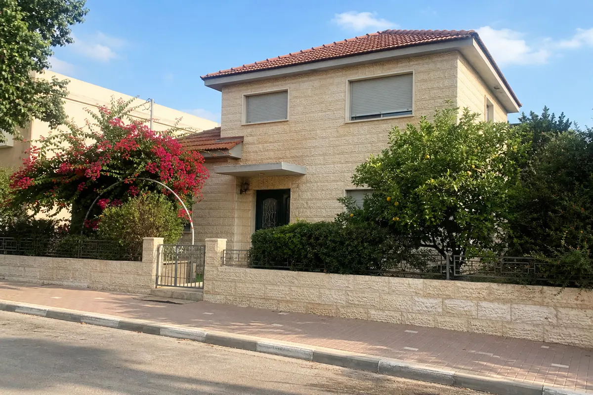 A real street with houses and parked cars